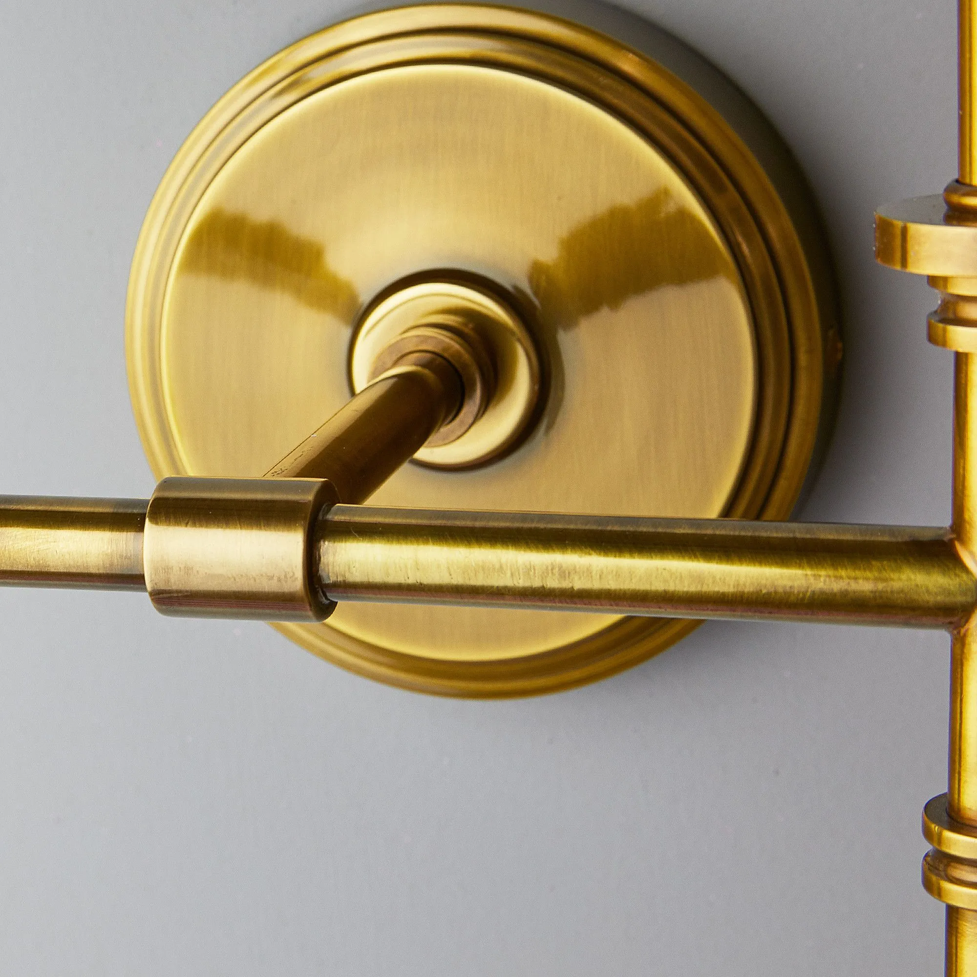 Double Chukka Wall fitting in antiqued brass