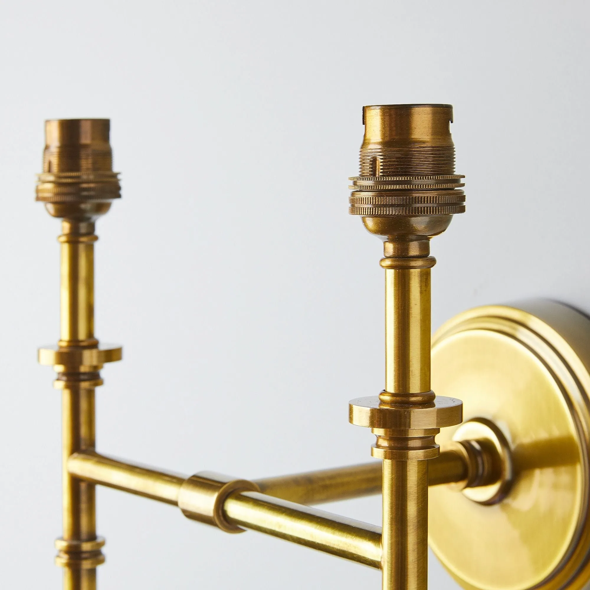 Double Chukka Wall fitting in antiqued brass
