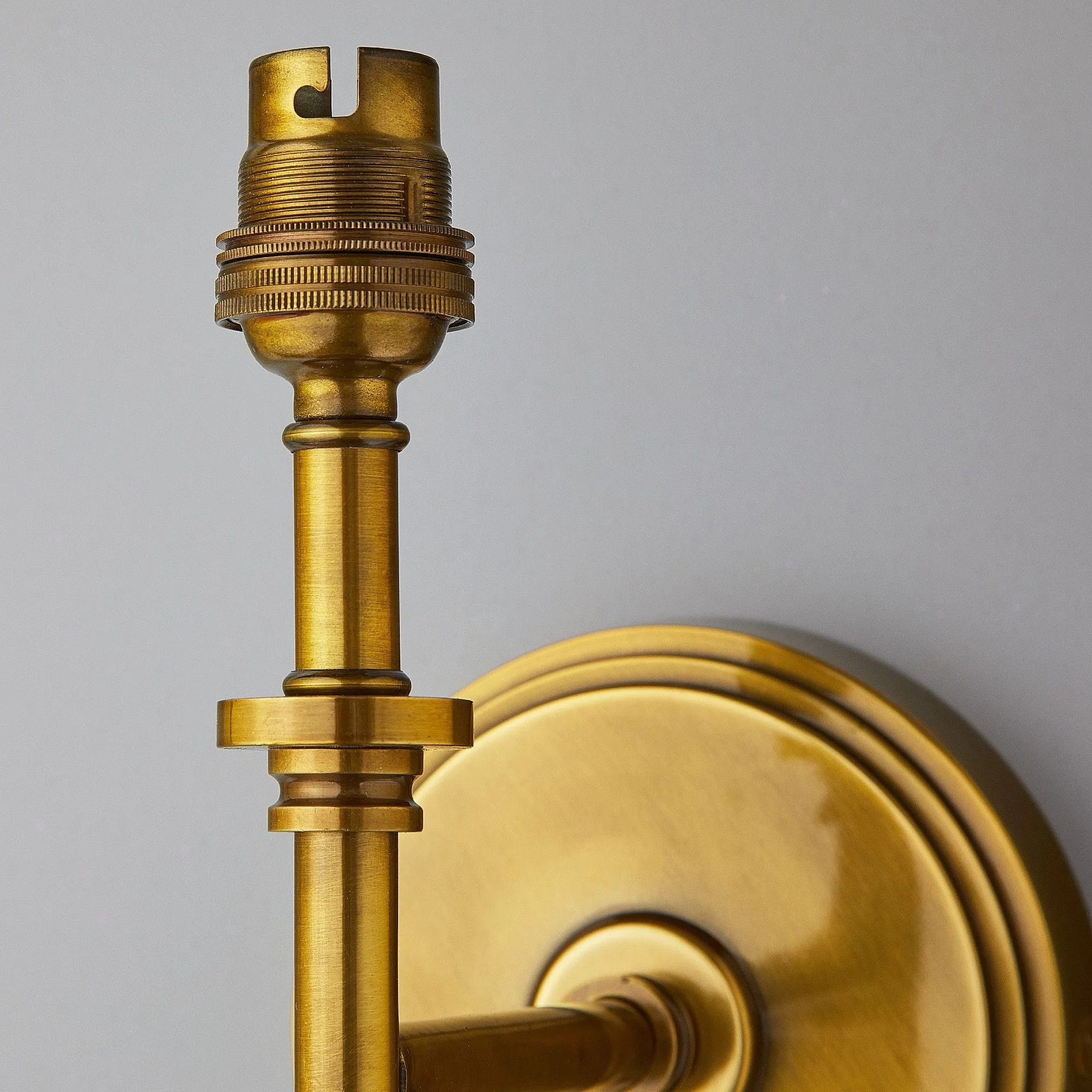 Single Chukka Wall fitting in antiqued brass